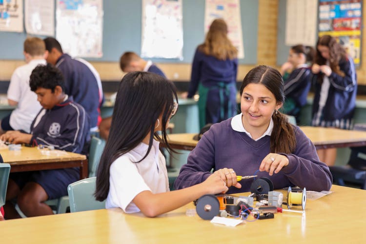 Students engaged in an electronics lesson