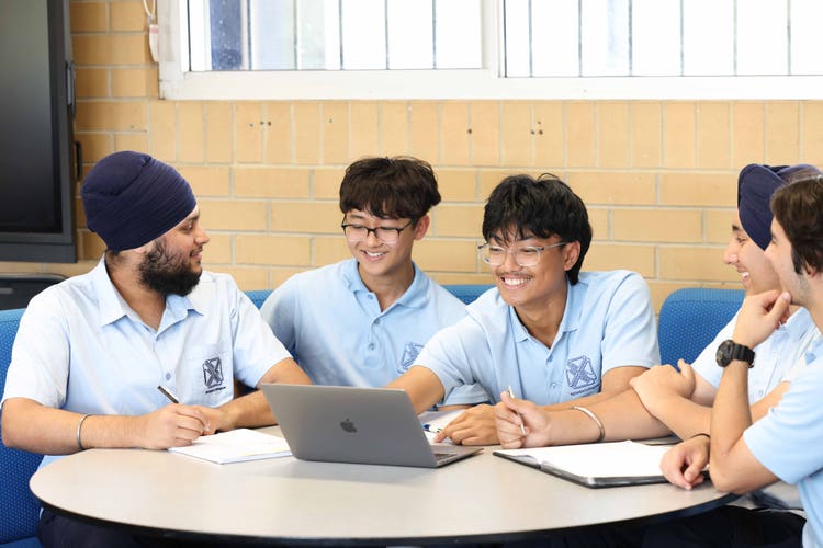 Five students working together in the senior learning hub